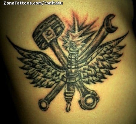 Custom spark plug color arm tattoo by Jon von Glahn TattooNOW